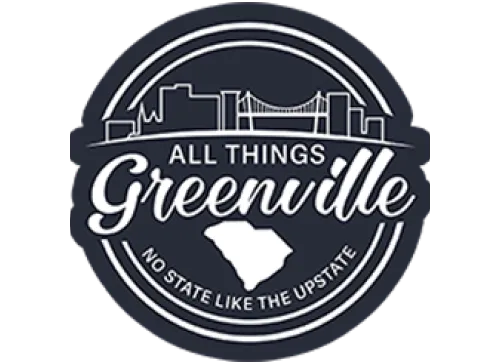 Circular logo with Greenville skyline, a bridge, and state outline; text reads “All Things Greenville.”.