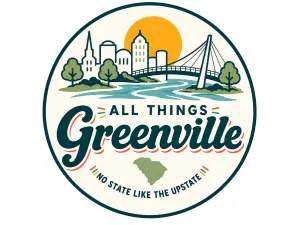 atg-1 Circular logo with a city skyline, river, bridge, sun, and text: “All Things Greenville. No State Like The Upstate.”.